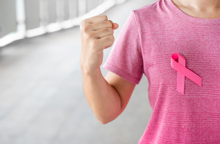 October Buubs Breast Cancer Awareness month, Woman in pink T- shirt with Pink Ribbon for supporting people living and illness. Healthcare, International women day and World cancer day concept