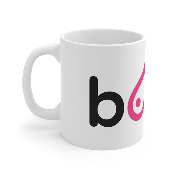 White ceramic 11ox. coffee mug with Boobs prints and pink ribbon identity